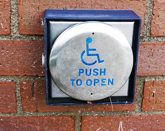 Handicap door push button